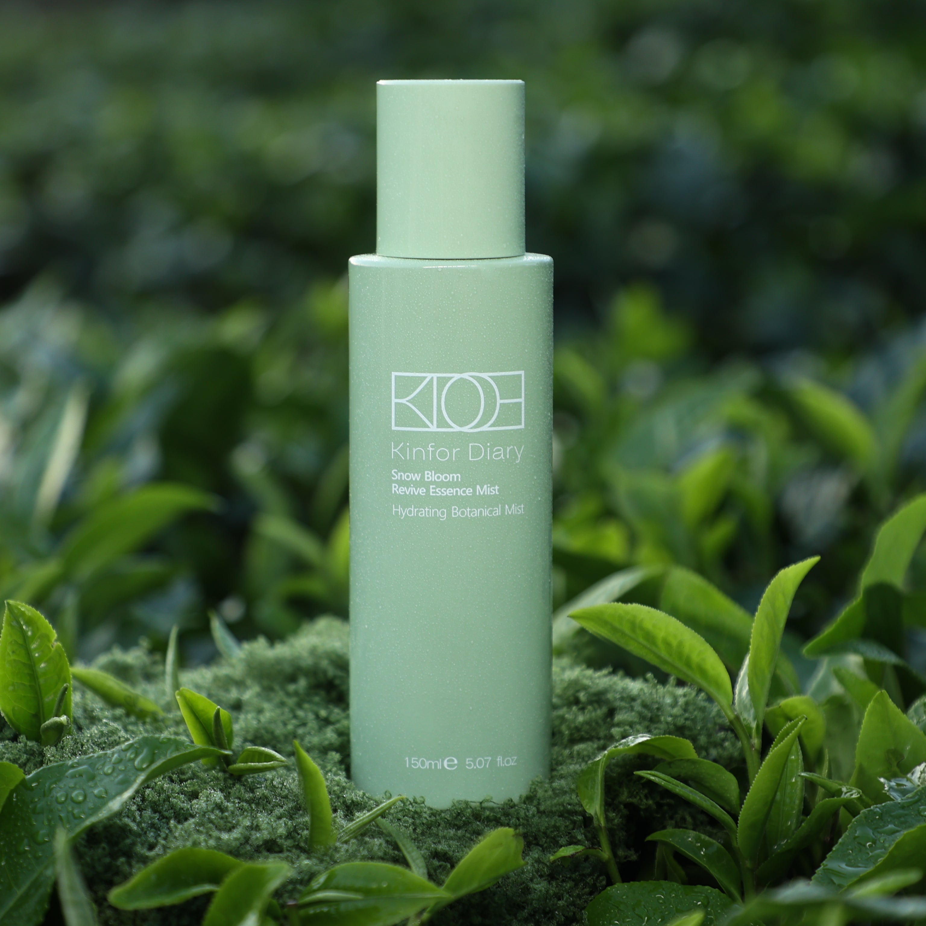 Green bottle with 'KIOH' branding on a bed of green leaves