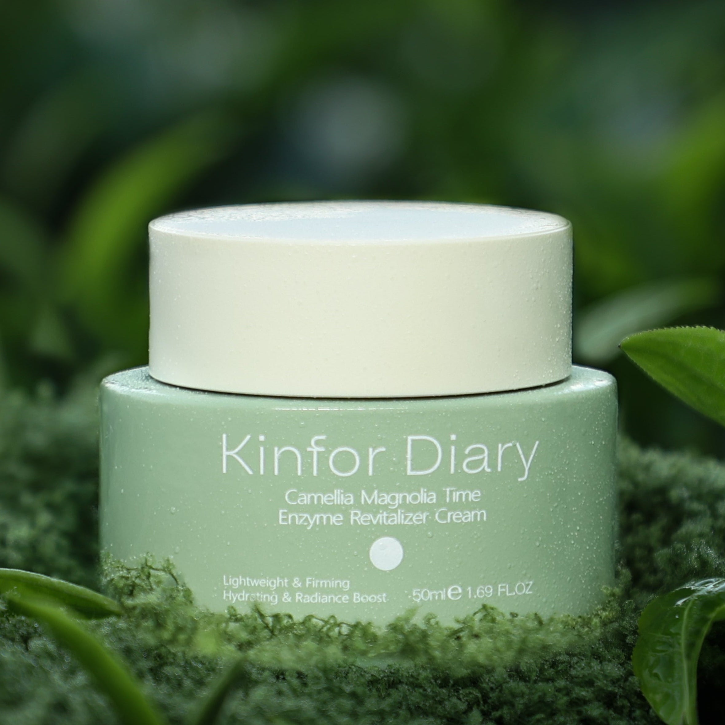 Green jar of Kinfor Diary cream on a grassy background